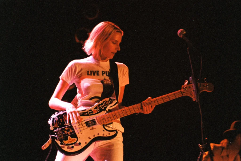 Aimee Mann performing in the 1990s, the decade Jon Brion produced Whatever and I'm with Stupid