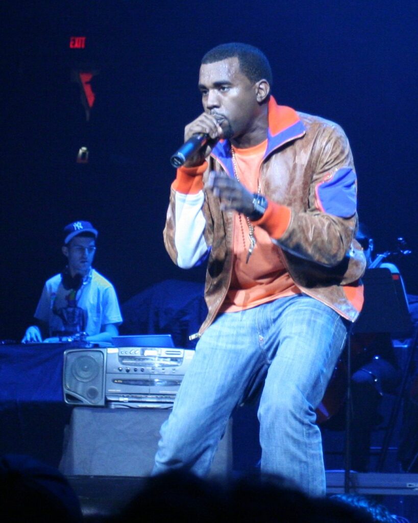 Kanye West performing in Portland, Oregon, December 2005, with A-Trak behind him